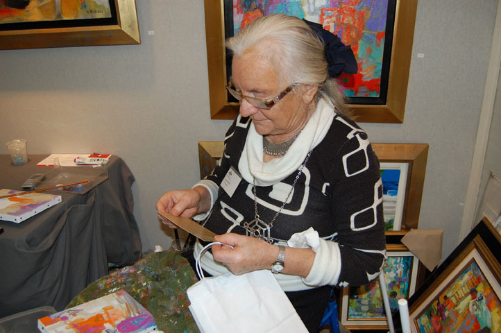 Monique Baroni reading a card from me.